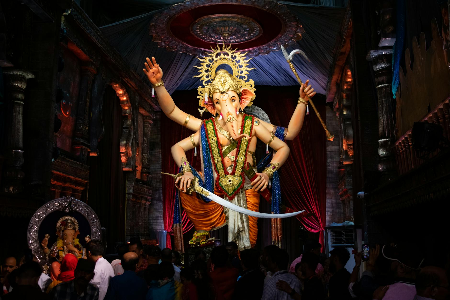 1. Removable Wallpaper — The Single Biggest Visual Upgrade - Colorful Ganesh idol surrounded by devotees during Ganesh Chaturthi festivities 