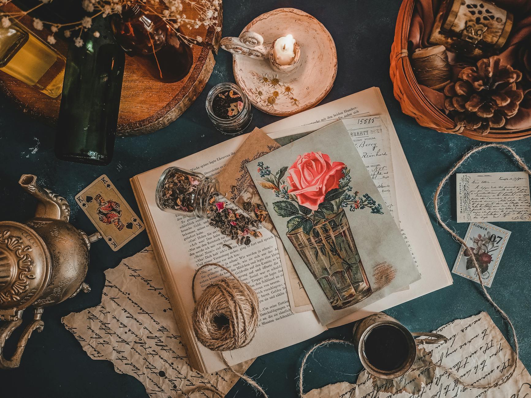 4. Decoupage a Side Table - A curated vintage still life featuring antique elements, calligraphy, and postca