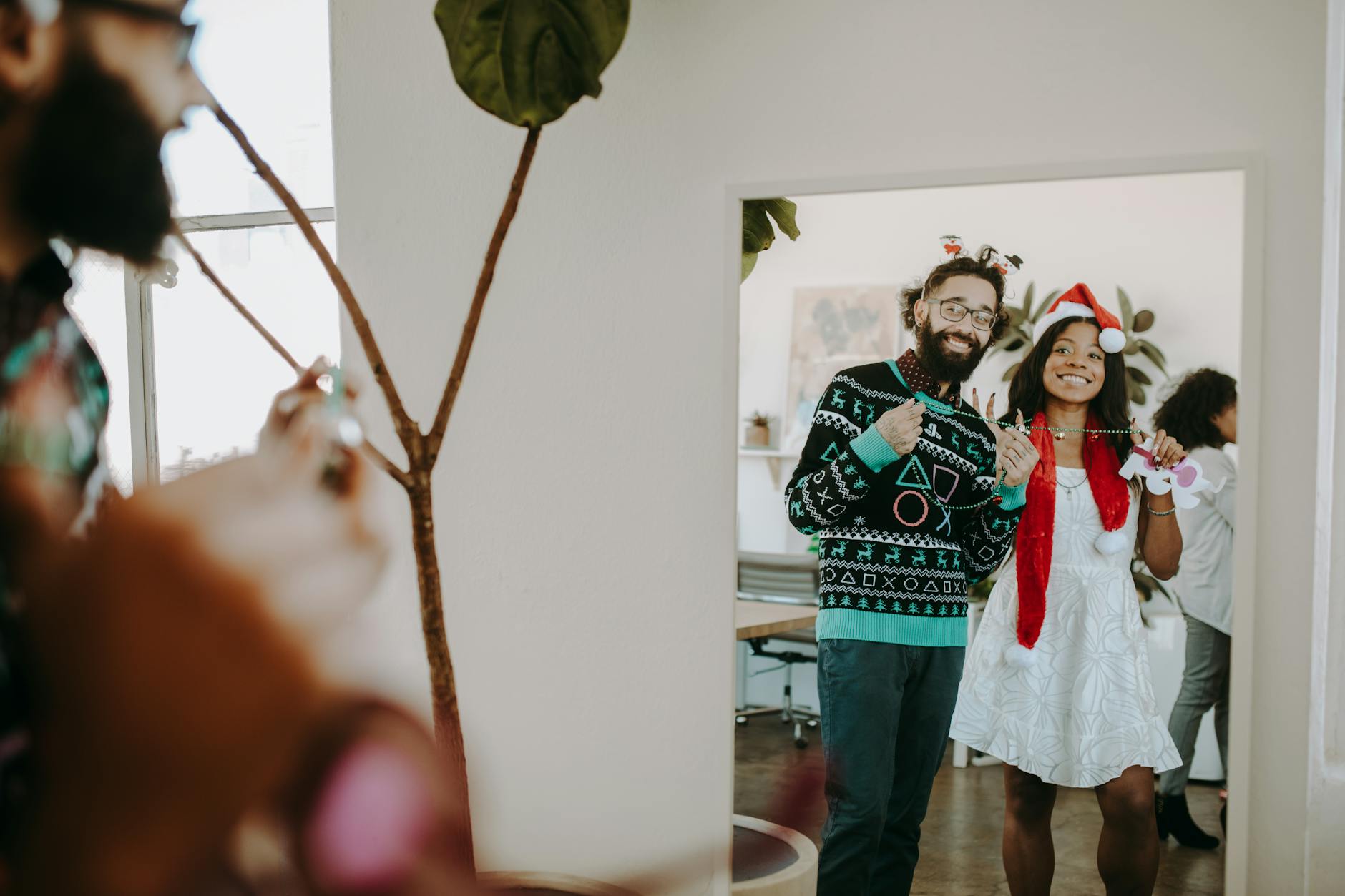 5. Area Rugs Over Ugly Carpet (Yes, This Works) - Happy colleagues in festive attire enjoying office Christmas party indoors.
